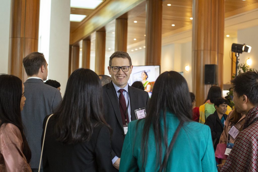 Mr Paul Wojciechowski, Assistant Secretary of DFAT’s South Asia Branch with scholars at the Welcome Reception